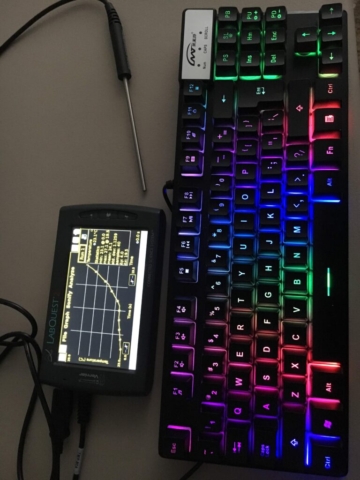 TLQ in high contrast mode with a temperature probe setup displaying graph page and glowing rainbow keyboard.