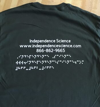 back of t-shirt featuring the words Independence Science along with phone number, 866-862-9665 and the website independencescience.com in both large print and braille